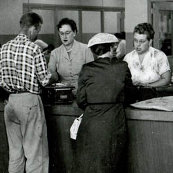 Citizens Being Served at Light and Water Desk, 1956