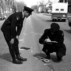 Two Saskatoon Policemen at Accident Scene, [ca. 1967]