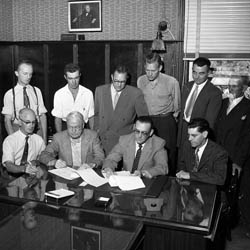 Signing Collective Agreement, 21 July 1955