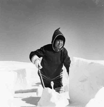 Eskimo Man Building an Igloo