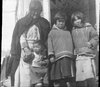 Grandmother with three Inuit children., Department of Physics fonds
