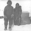 Inuit family at entrance to igloo., Department of Physics fonds