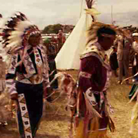 People in traditional dress performing dance at Pion-Era