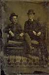 Could the man on the right be WC Murray?  Both men are wearing bowler, or derby hats; first created in 1849 and extremely popular into the 1920s. Their style of clothing suggests a date ca. 1890, when WC Murray would have been 24 years old. 