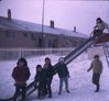Children on a slide in the Black Lake School yard. 12/69, R.M.  Bone  fonds