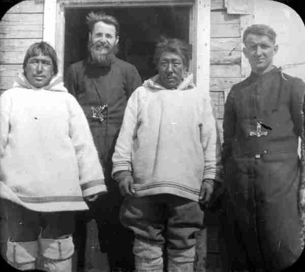 Father Henri, Brother Paradis and Two Inuit [Parishioners].