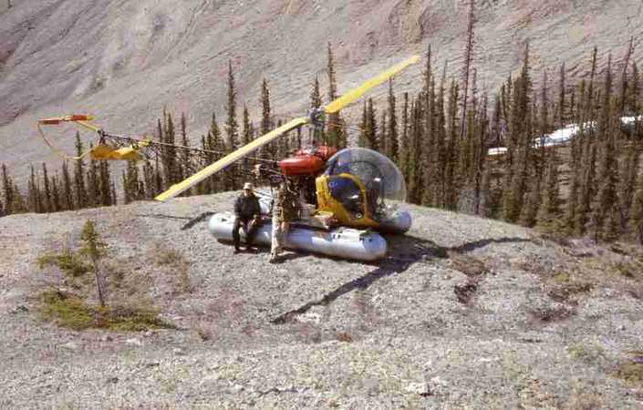 Bell helicopter parked at Devonian Bear Rock at Jacques Ridge