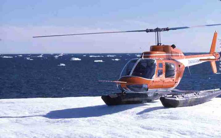 Helicopter landing on ice floe. 																																																