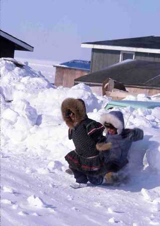 Two Inuit children playing.																																																																																