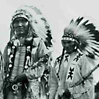 Three Indians in ceremonial regalia