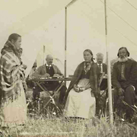 Métis sitting around table during  North-West "Half-Breed" Commission, Devil’s Lake,  1900