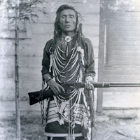 Atimoyoo: an armed man in traditional dress